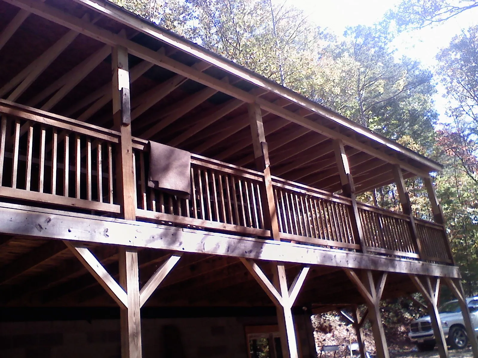 Timber framing under a new elevated porch and deck — Roof Leak Repair in Schwertner by Roofing Brothers